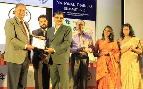 Dr. Binoy Joseph, Principal receiving the Excellence Award for Innovative Training Practicesfor Rajagiri College of Social Sciences during the National Trainers Summit 2017 from Mr. Jose Philip, Chairman, Indian Society for Training and Development (ISTD). Dr. L Radhakrishnan IAS, Dr. K Poulose Jacob, Pro Vice Chancellor, Cochin University, Ms. Chandra Vandana, CEO, T4Trainer.com, Ms.Nirmala Lilly, Secretary, ISTD were also present at the occasion.